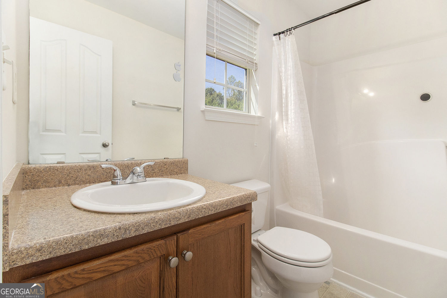 48 Garden View Terrace Newnan, GA 30263 - Photo 23 of 25 a bathroom with a sink toilet and a mirror