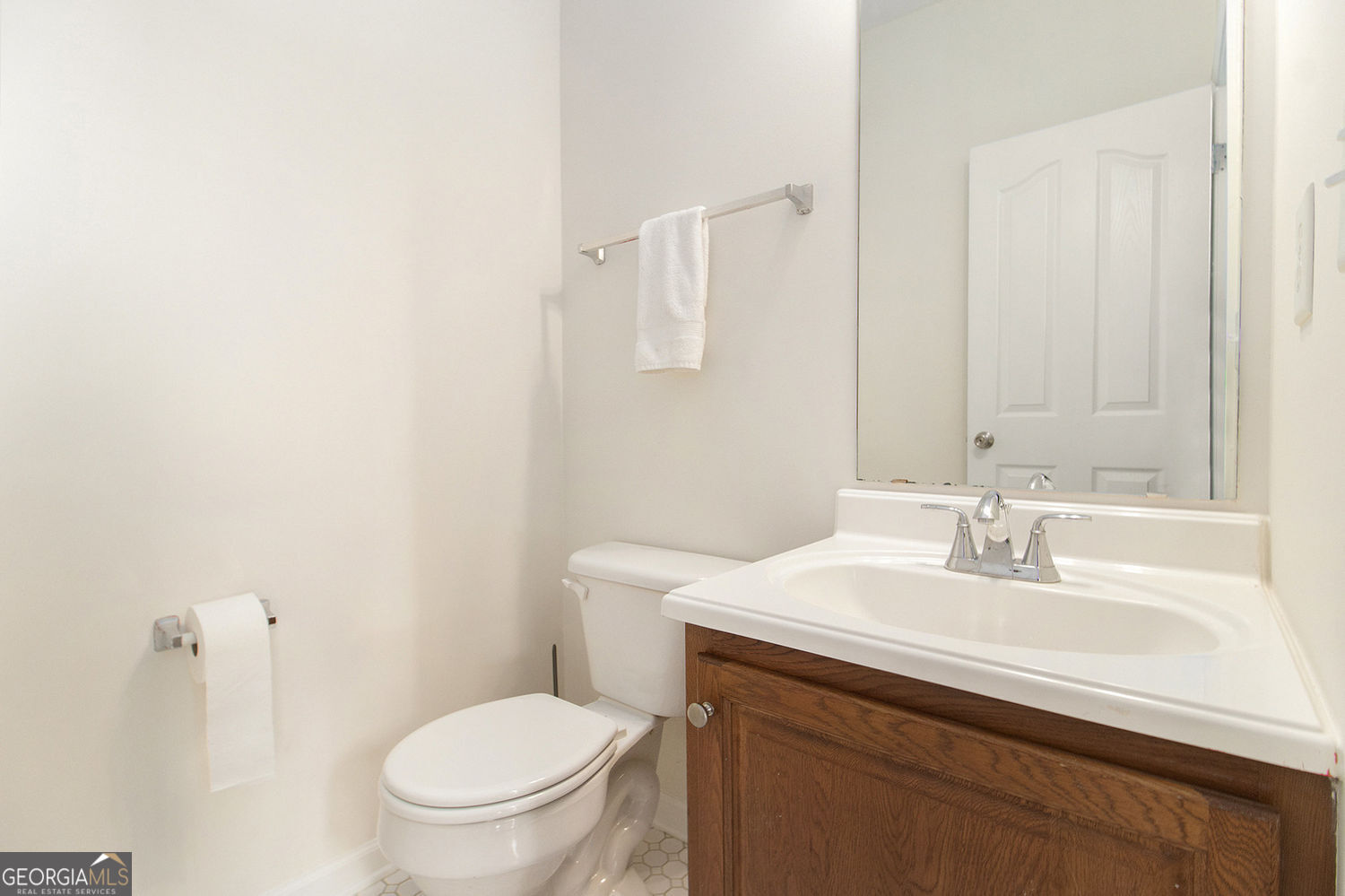 48 Garden View Terrace Newnan, GA 30263 - Photo 24 of 25 a bathroom with a sink a toilet and a mirror
