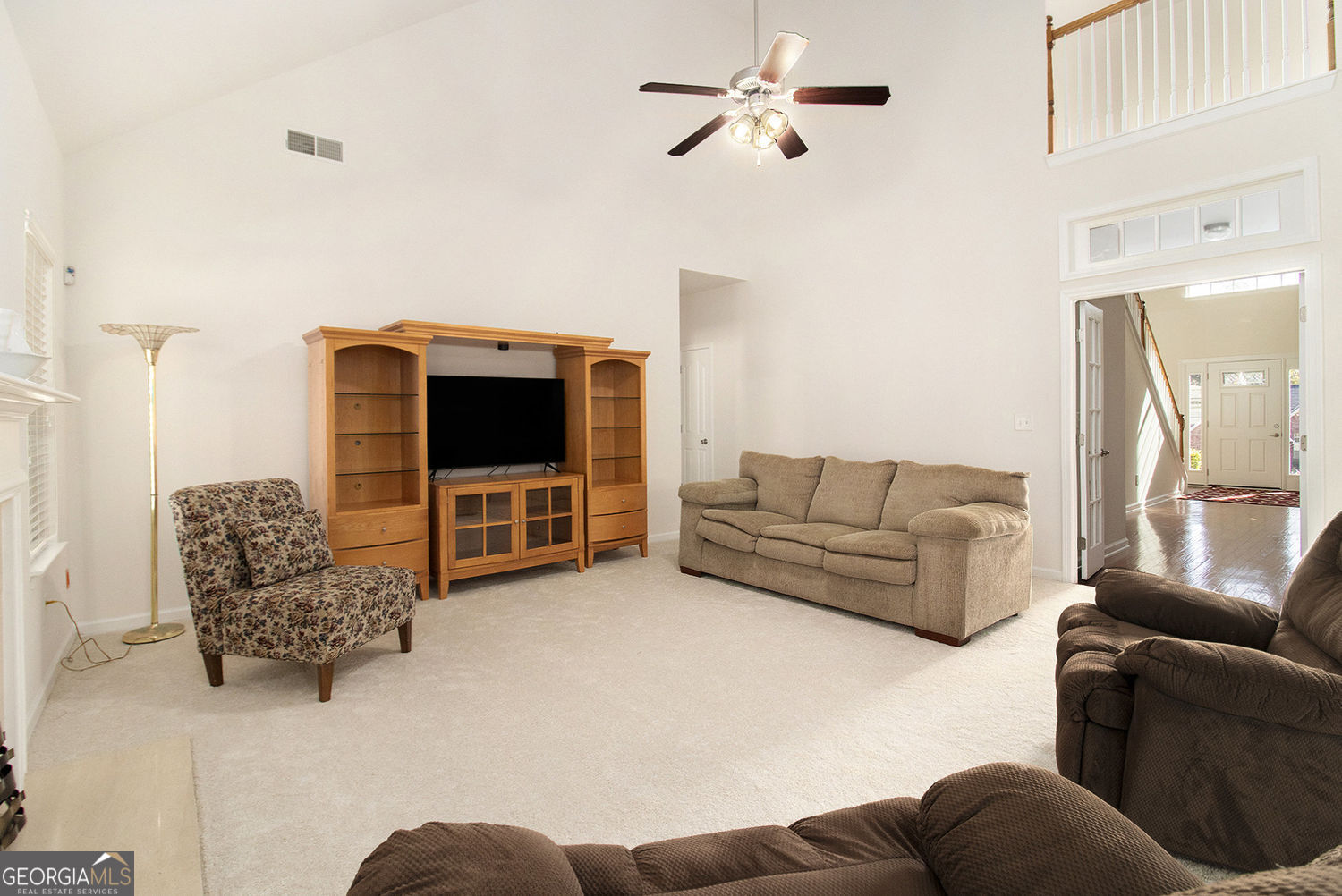 48 Garden View Terrace Newnan, GA 30263 - Photo 9 of 25 a living room with furniture and a flat screen tv