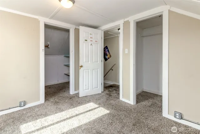a view of a bathroom with a shower and closet