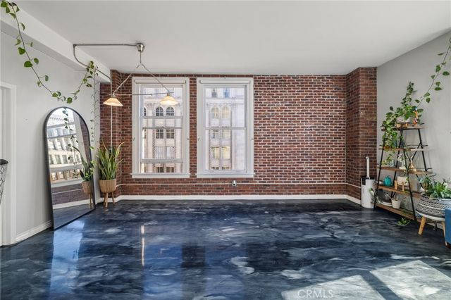 a view of entrance with wooden floor and a fireplace
