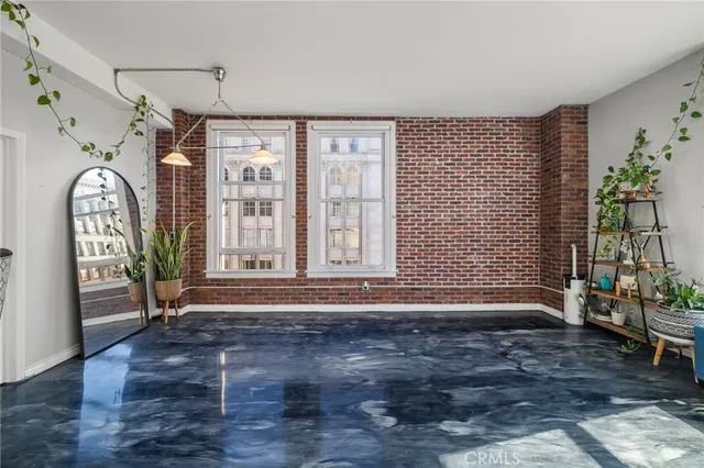 a view of entrance with wooden floor and a fireplace