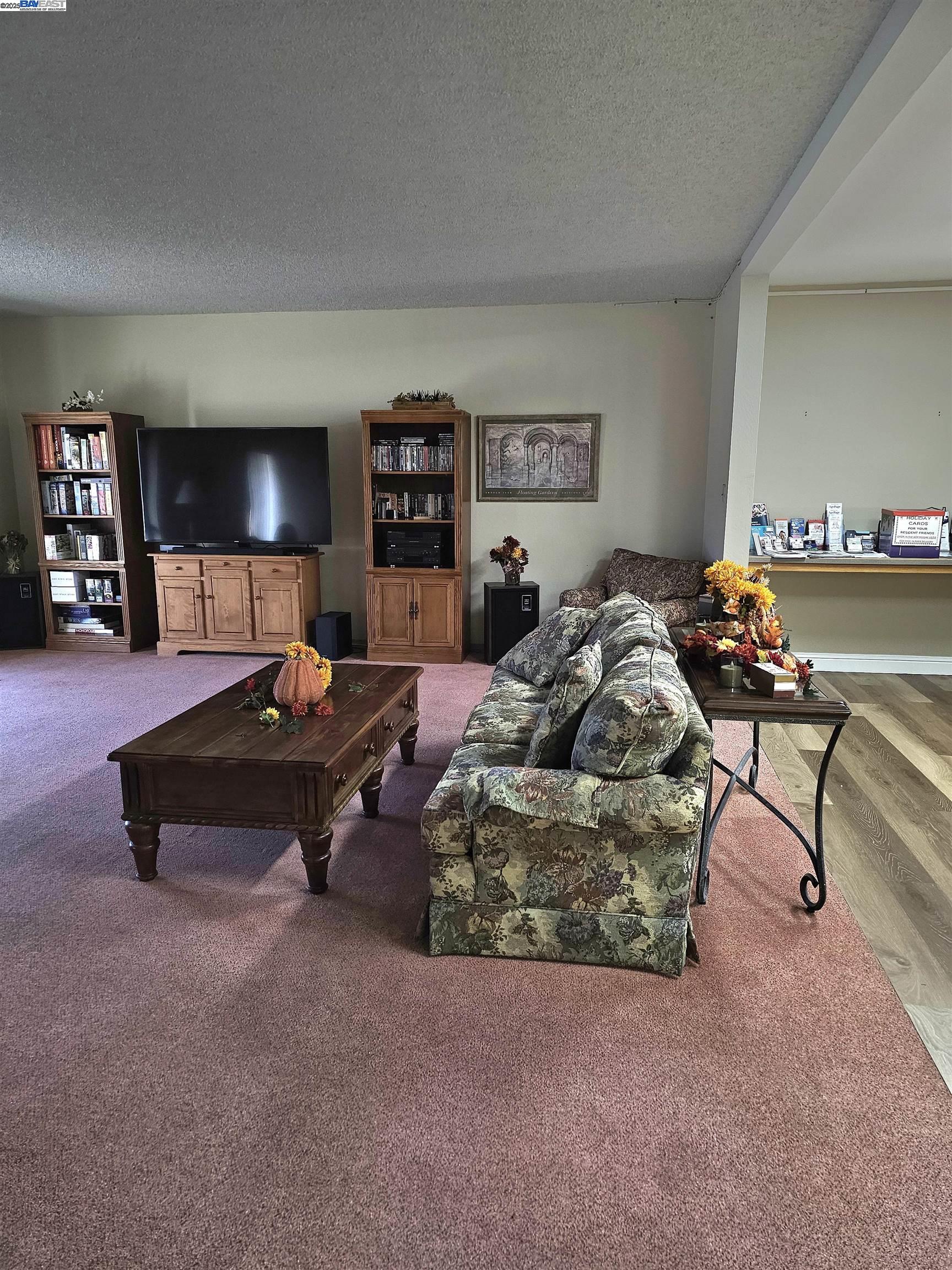 4141 Deep Creek Road, Unit 106 Fremont, CA 94555 - Photo 34 of 37 a bed room with furniture and a night stand