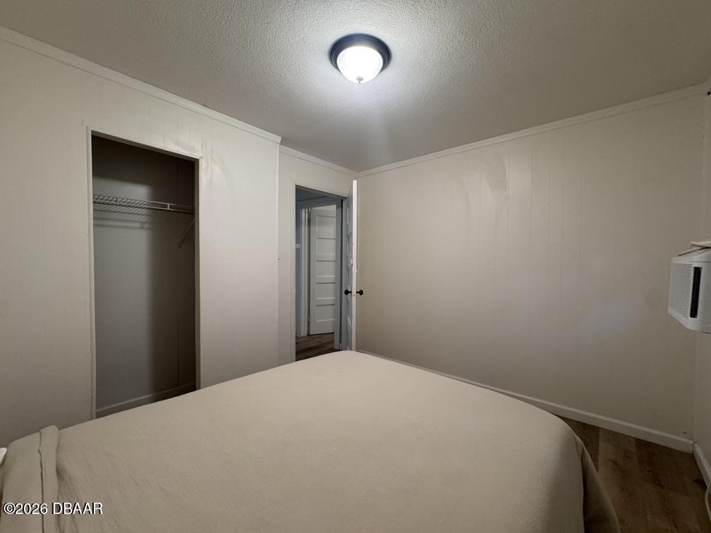 607 Herbert Street Port Orange, FL 32129 - Photo 18 of 26 a bedroom with a bed and a window