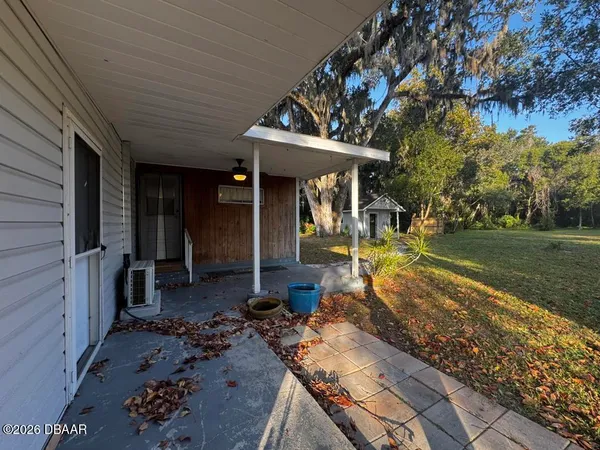 a view of a porch with furniture