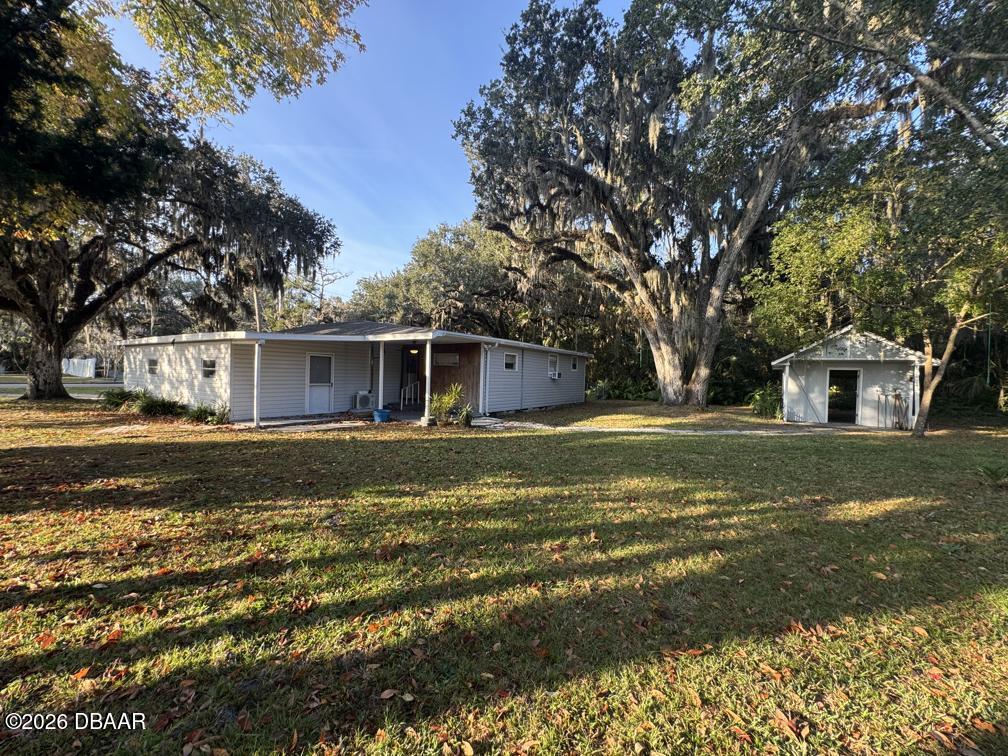 607 Herbert Street Port Orange, FL 32129 - Photo 22 of 26 a view of pool with tree s
