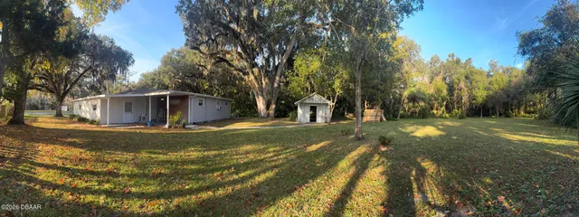 a view of a yard with swimming pool