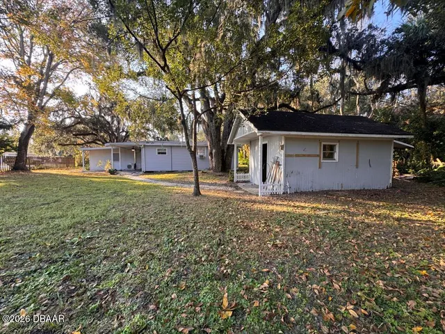 a backyard of a house with lots of green space