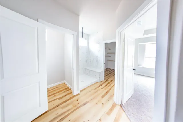 a spacious bathroom with a double vanity sink and a mirror