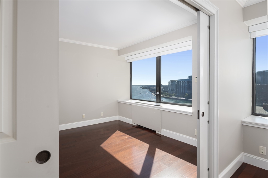 85 East India Row, Unit 15E Boston, MA 02110 - Photo 11 of 20 a view of a hallway with an entryway