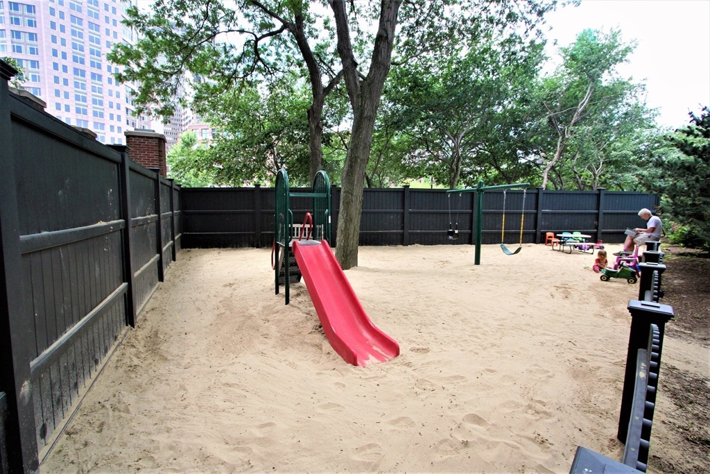 85 East India Row, Unit 15E Boston, MA 02110 - Photo 20 of 20 a view of swimming pool with a backyard and slide