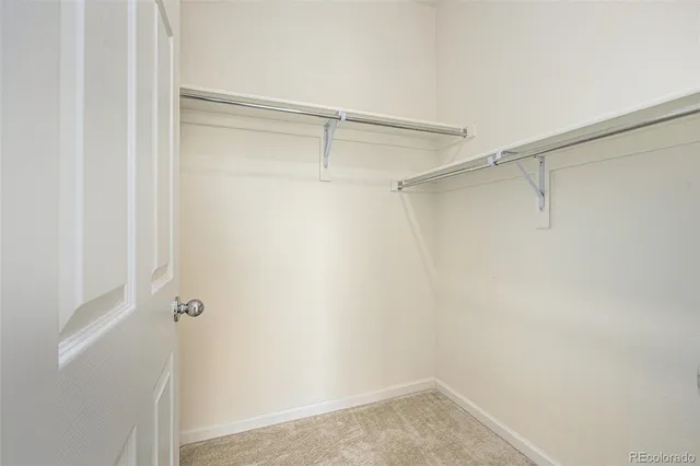 a view of an empty walk in closet