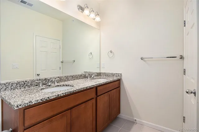 a view of a backyard patio and fire pit