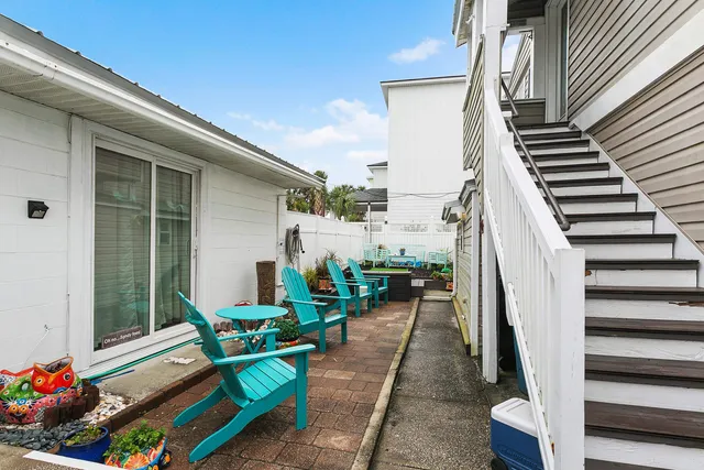 a view of a white house with a view of the city and a lake view