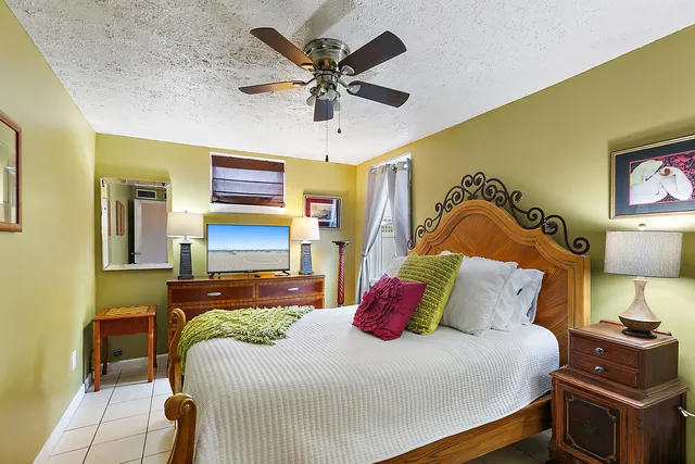 a bedroom with furniture and a window