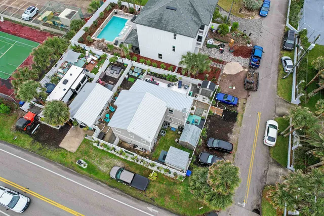an aerial view of residential house with outdoor space and parking