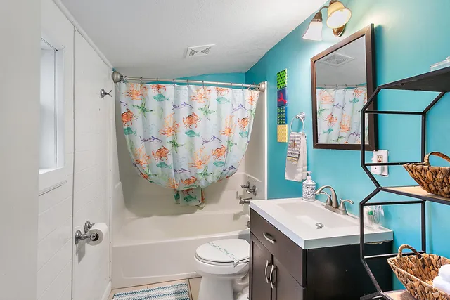 a view of kitchen and hallway with wooden floor