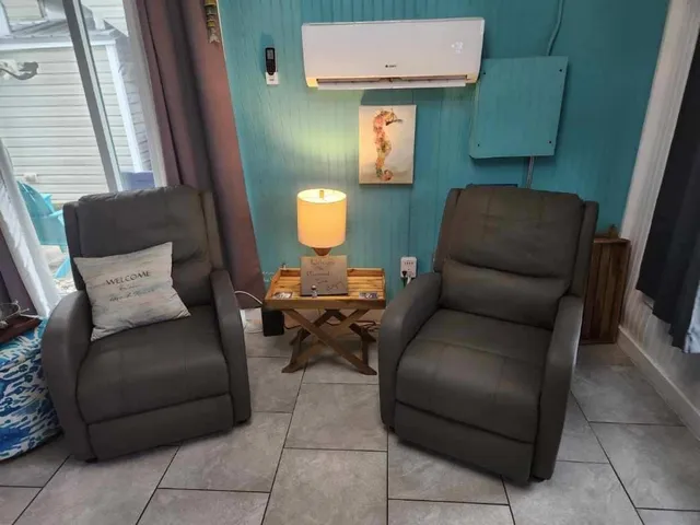 a bedroom with a bed and a mirror on the dresser