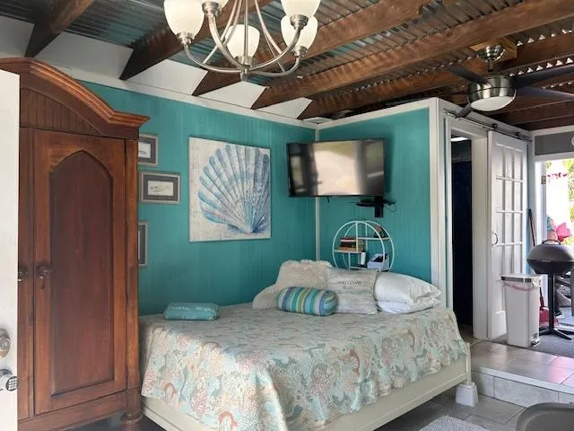 a bathroom with a sink a mirror a bathtub and shower