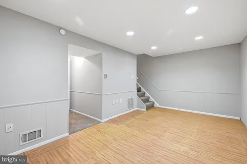 a view of a livingroom with wooden floor