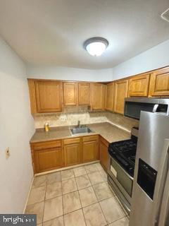 1983 Addison Road South District Heights, MD 20747 - Photo 4 of 13 Kitchen w/ Stainless Steel Appliances