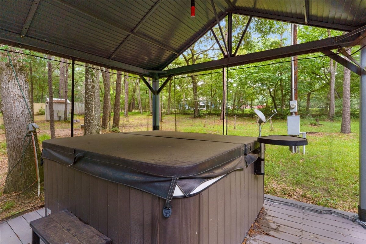 16375 Grand Flower Road Plantersville, TX 77363 - Photo 46 of 50 a house view with a outdoor seating