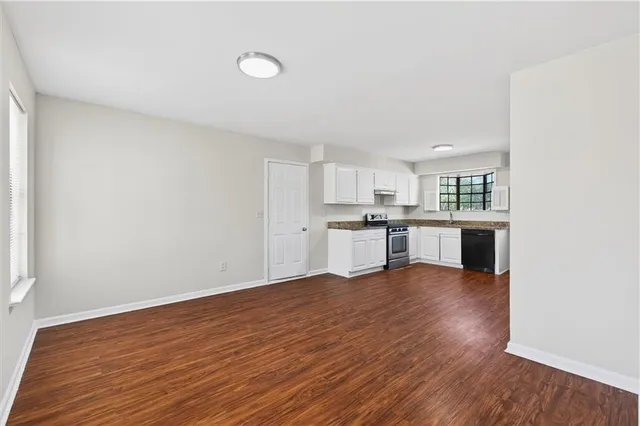 a view of kitchen with wooden floor