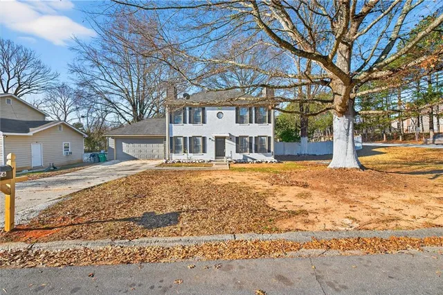 a house with trees in front of it
