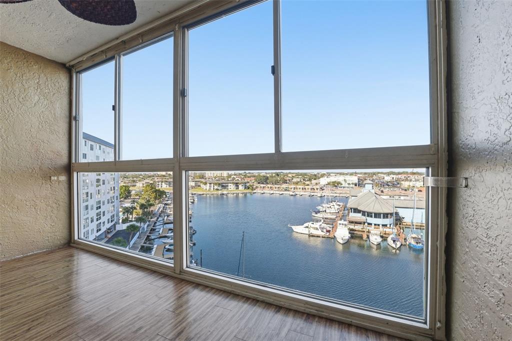 4939 Floramar Terrace, Unit 712 New Port Richey, FL 34652 - Photo 1 of 41 a view of a room with wooden floor