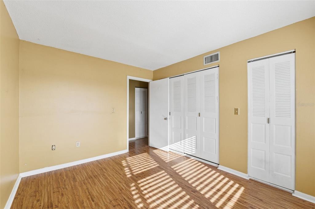 4939 Floramar Terrace, Unit 712 New Port Richey, FL 34652 - Photo 21 of 41 a view of a room with wooden floor and bathroom