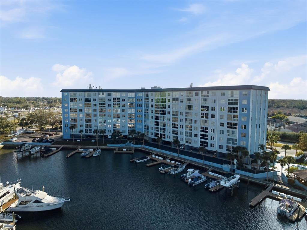 4939 Floramar Terrace, Unit 712 New Port Richey, FL 34652 - Photo 36 of 41 a view of a lake with tall buildings