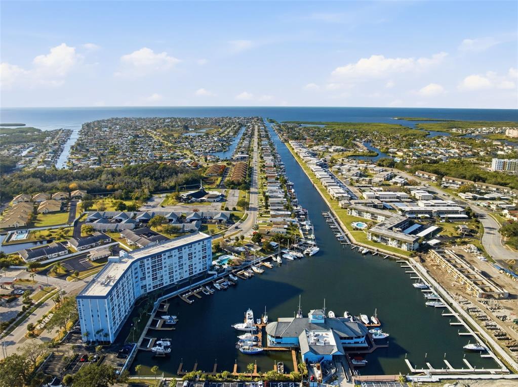 4939 Floramar Terrace, Unit 712 New Port Richey, FL 34652 - Photo 37 of 41 an aerial view of residential building and ocean view