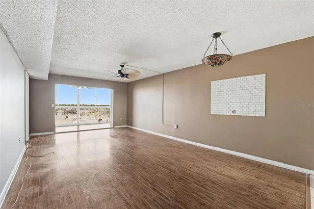 a view of a kitchen with a sink and a stove top oven