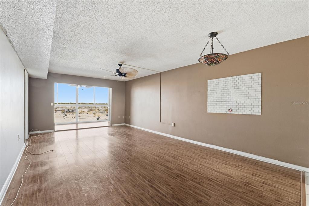 4939 Floramar Terrace, Unit 712 New Port Richey, FL 34652 - Photo 6 of 41 a view of a kitchen with a sink and a stove top oven