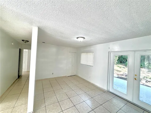 a view of an empty room and window