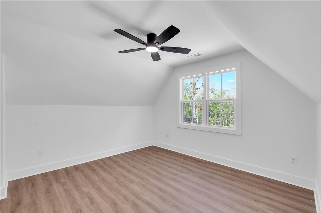 407 Blue Ridge Court Westminster, SC 29693 - Photo 33 of 48 This spacious room features vaulted ceilings and ample natural light, ideal for peaceful living.