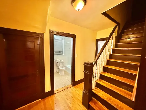 a view of entryway with wooden floor