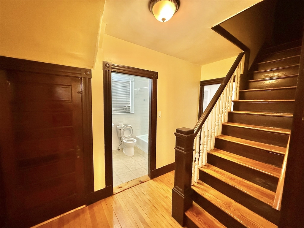 a view of entryway with wooden floor