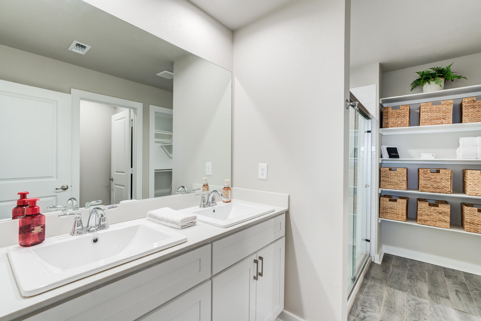 4613 126th Street Lubbock, TX 79424 - Photo 22 of 37 a bathroom with a sink and a mirror