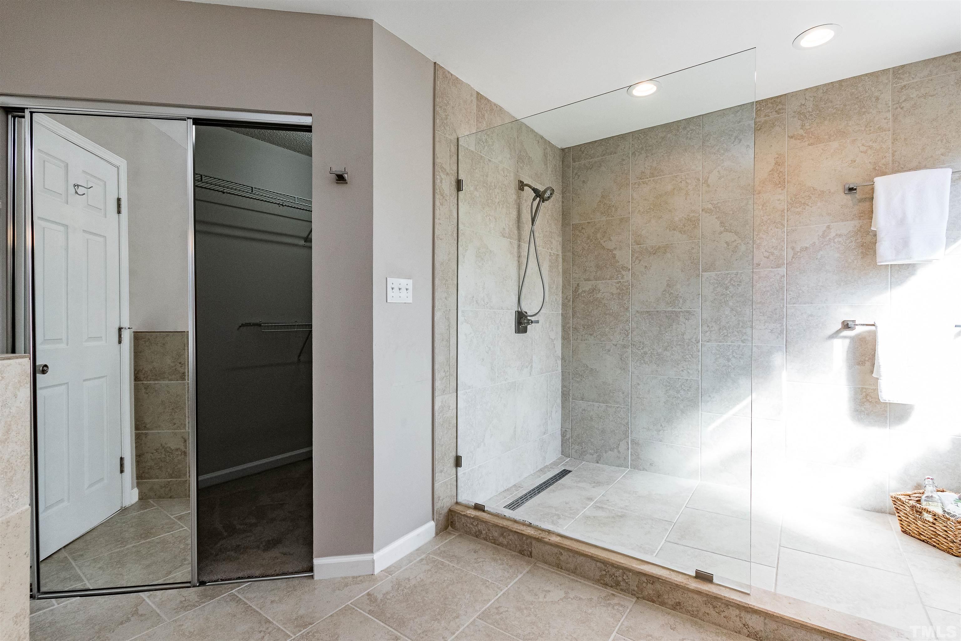 11801 Fairlie Place Raleigh, NC 27613 - Photo 14 of 32 a bathroom with a shower and a sink