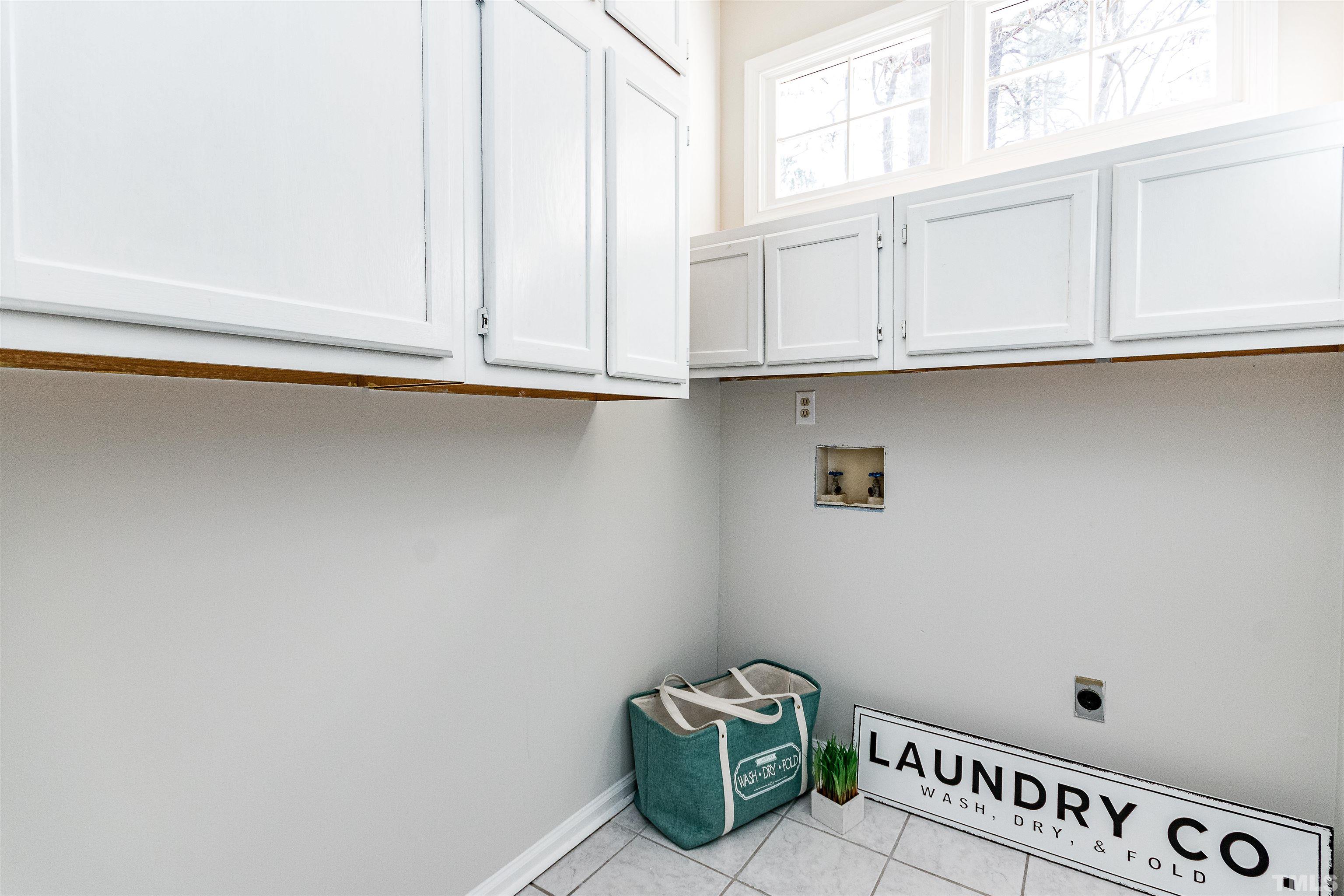 11801 Fairlie Place Raleigh, NC 27613 - Photo 20 of 32 a view of an empty room with a window