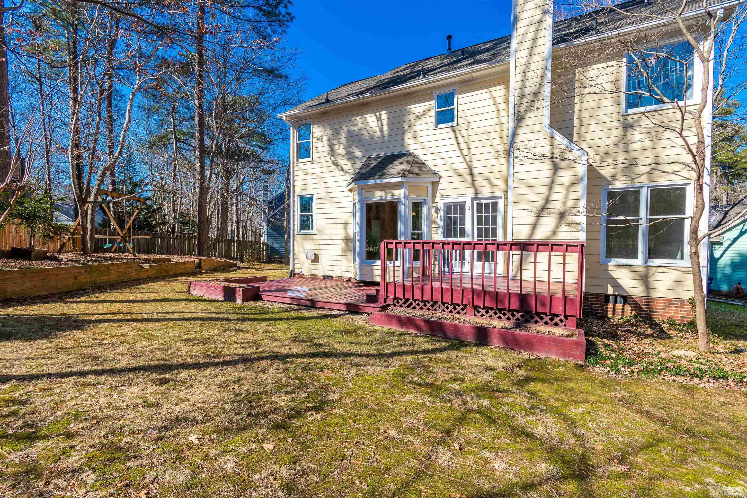 11801 Fairlie Place Raleigh, NC 27613 - Photo 24 of 32 a view of a house with backyard and sitting area