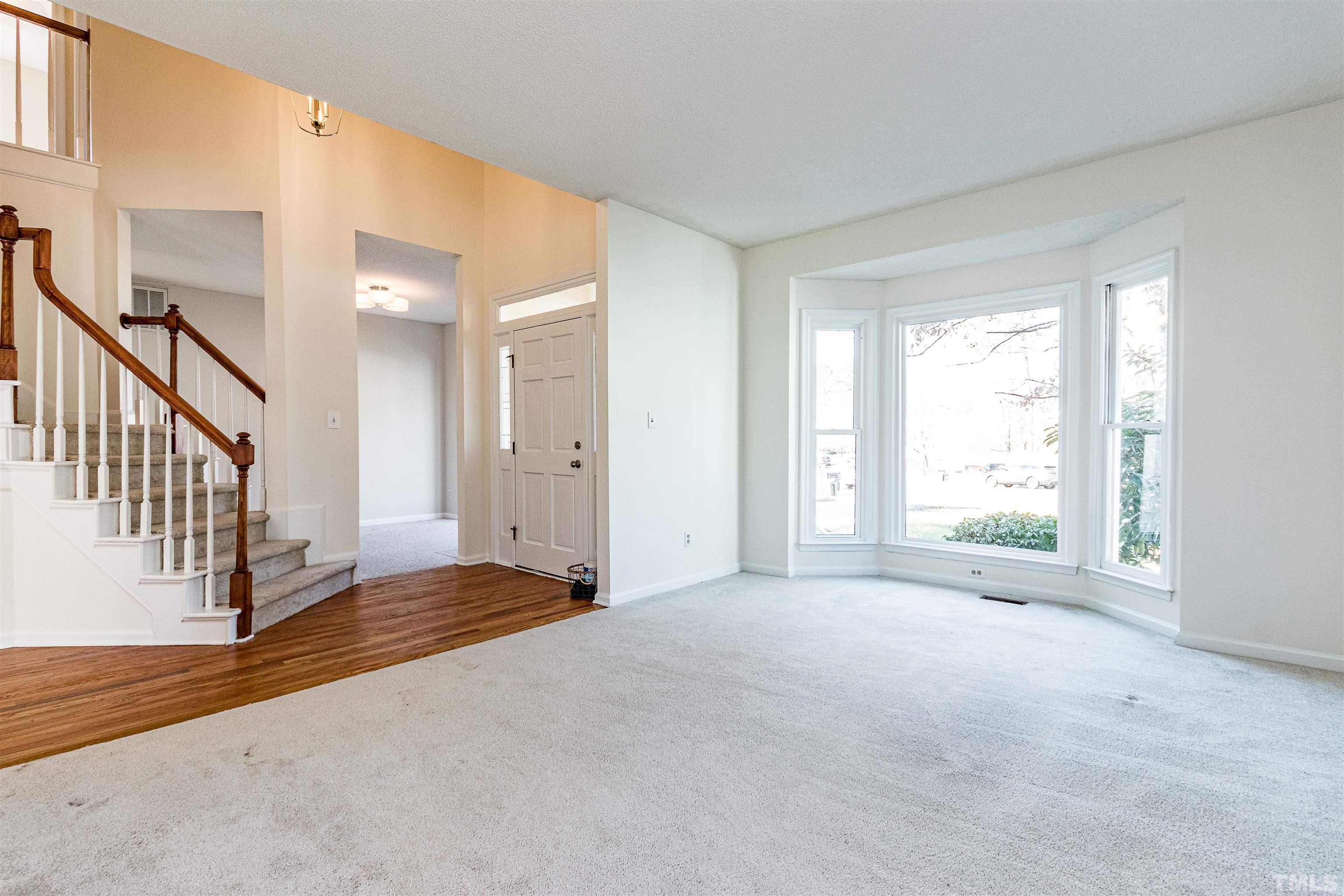 11801 Fairlie Place Raleigh, NC 27613 - Photo 9 of 32 a view of an empty room with a window