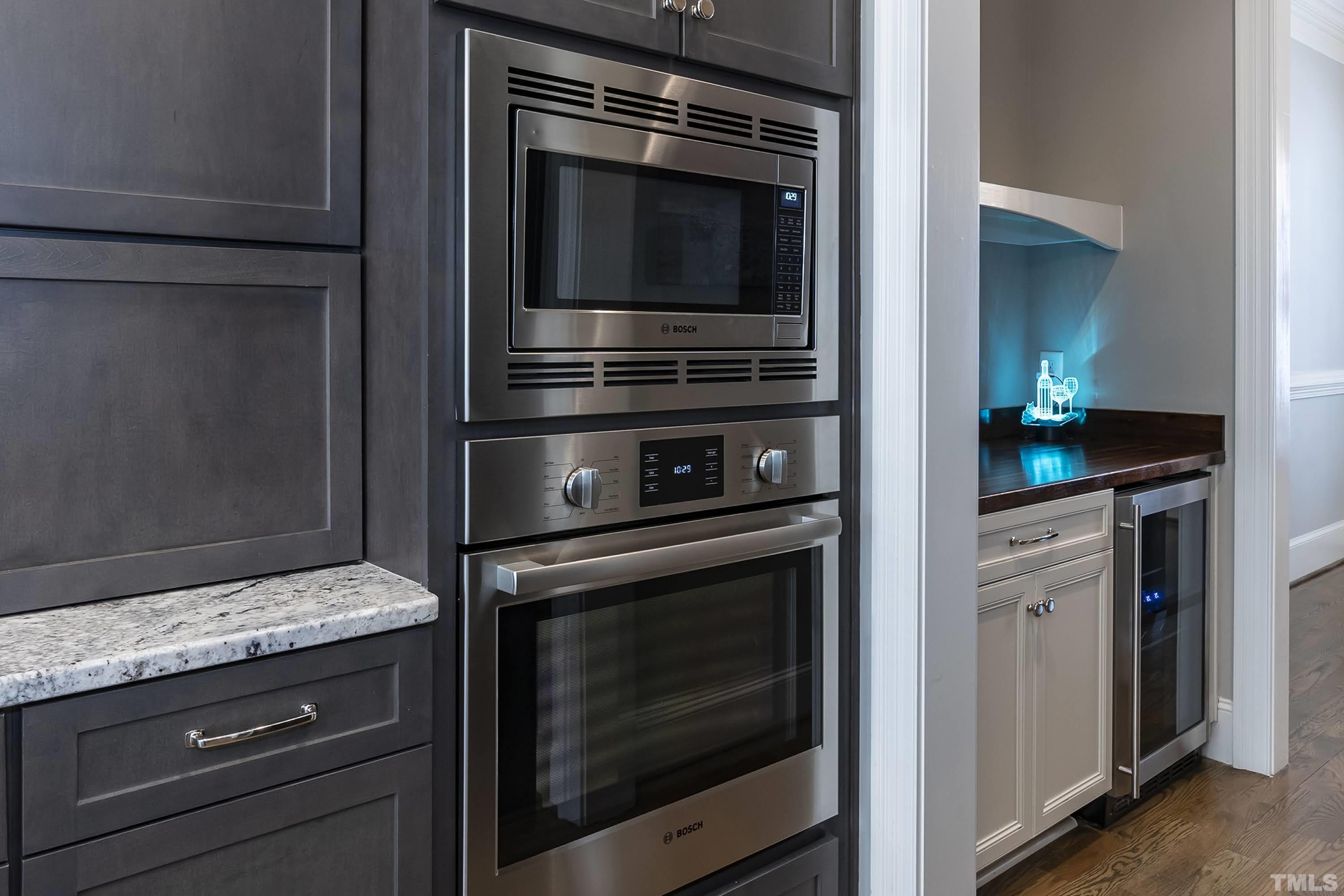 6418 Rosny Road Raleigh, NC 27613 - Photo 12 of 52 a stove top oven sitting inside of a kitchen
