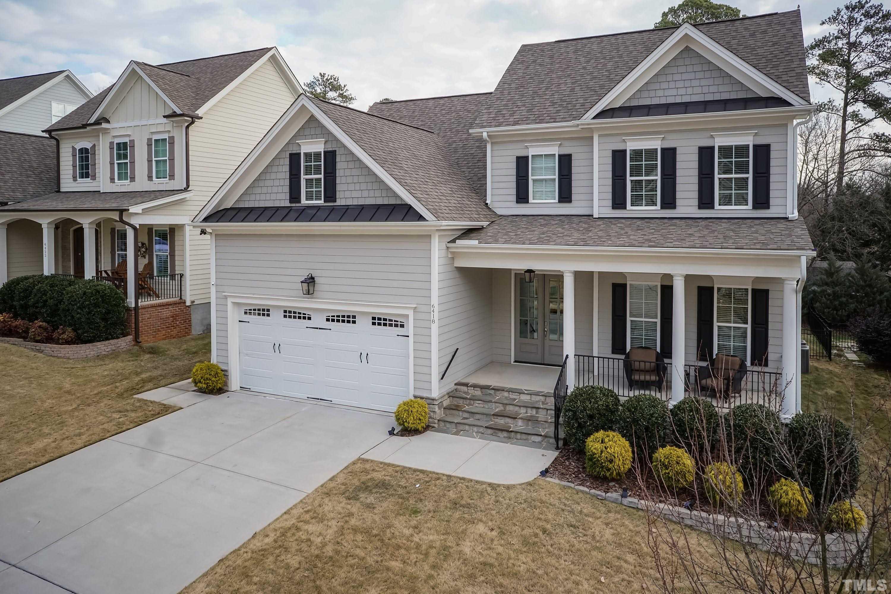6418 Rosny Road Raleigh, NC 27613 - Photo 2 of 52 a front view of a house with garden