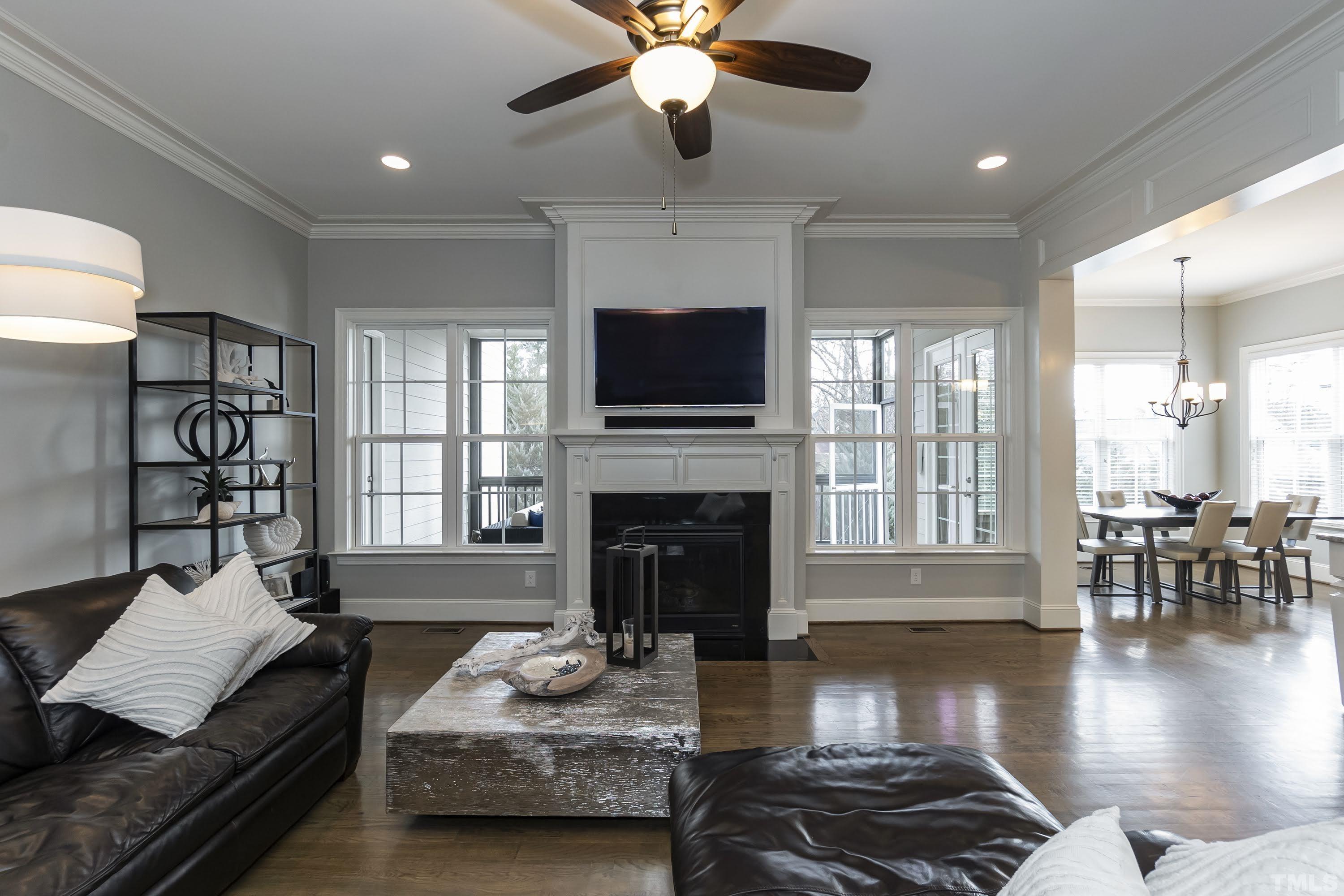 6418 Rosny Road Raleigh, NC 27613 - Photo 24 of 52 a living room with furniture or fireplace and a flat screen tv