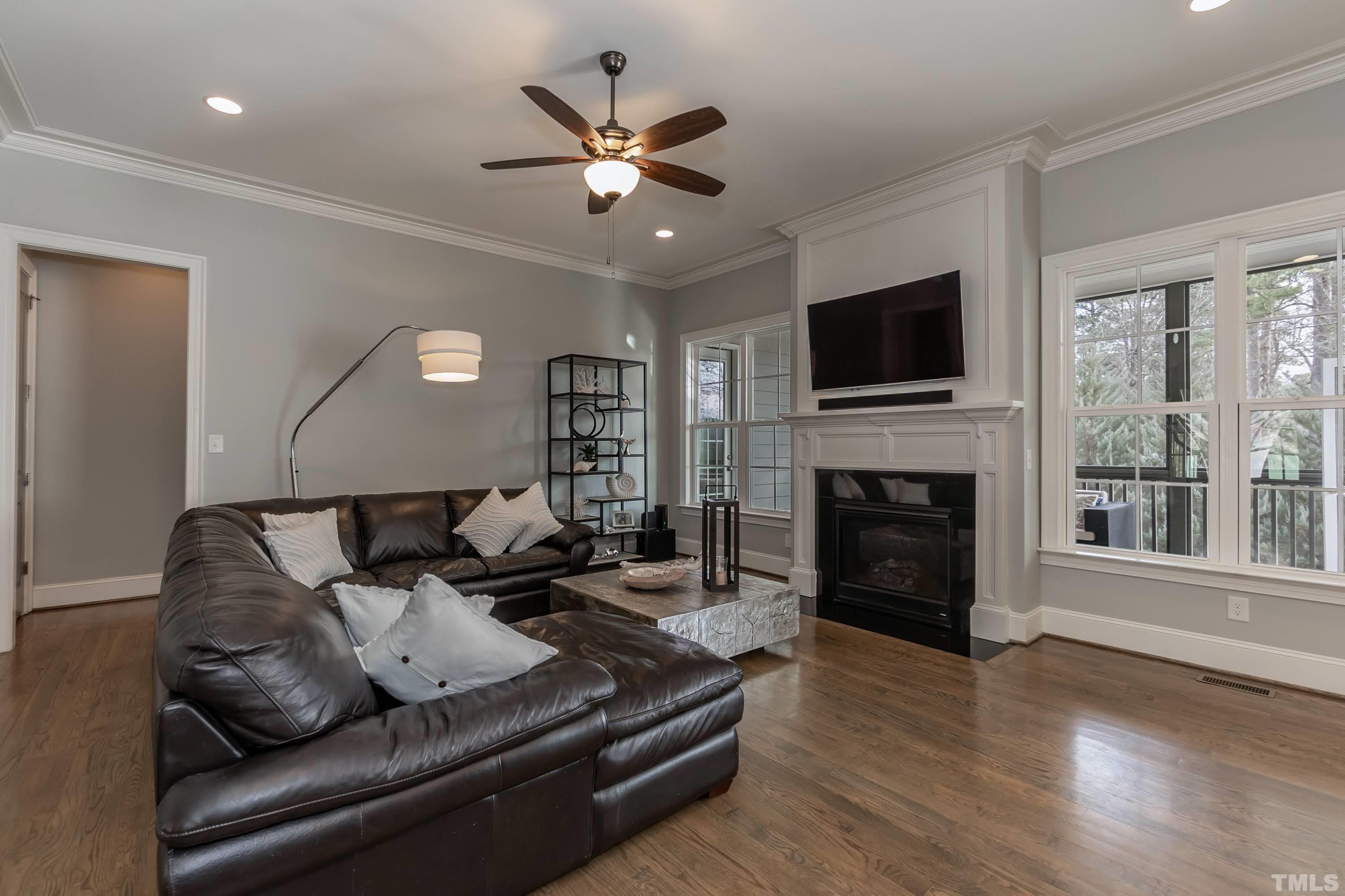 6418 Rosny Road Raleigh, NC 27613 - Photo 25 of 52 a living room with furniture fireplace and flat screen tv