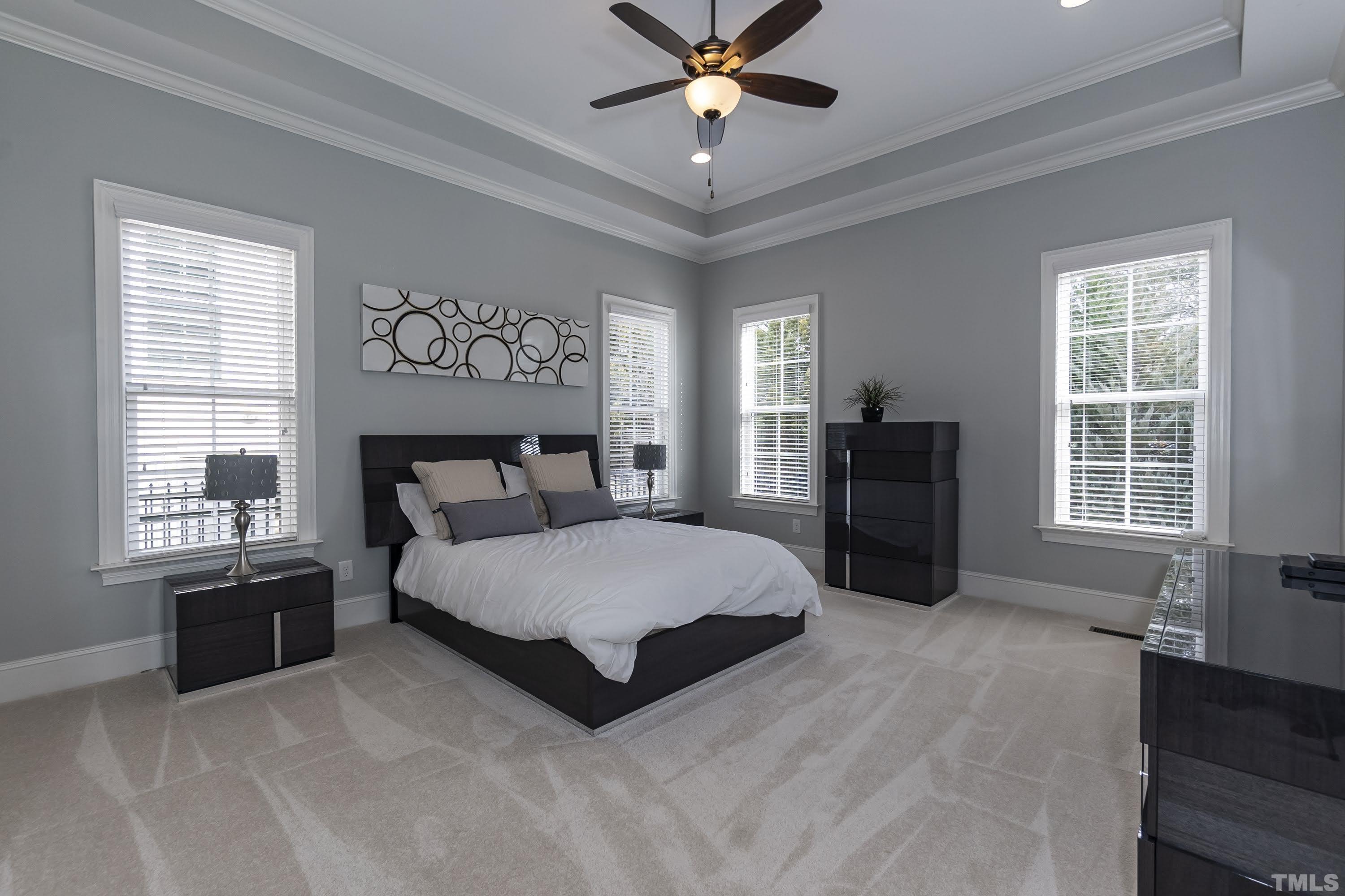 6418 Rosny Road Raleigh, NC 27613 - Photo 27 of 52 a spacious bedroom with a bed and window