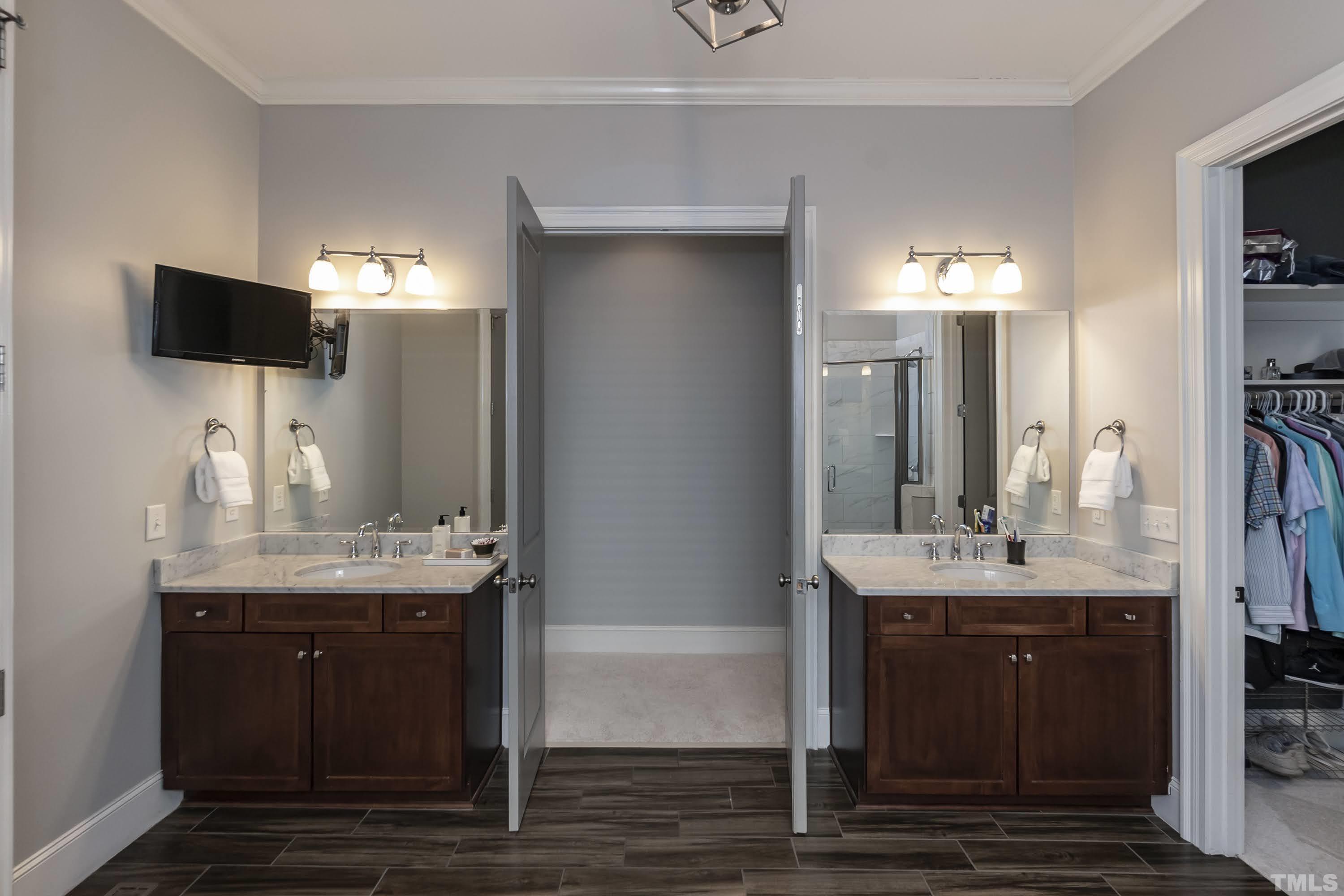 6418 Rosny Road Raleigh, NC 27613 - Photo 30 of 52 a bathroom with a sink and a mirror