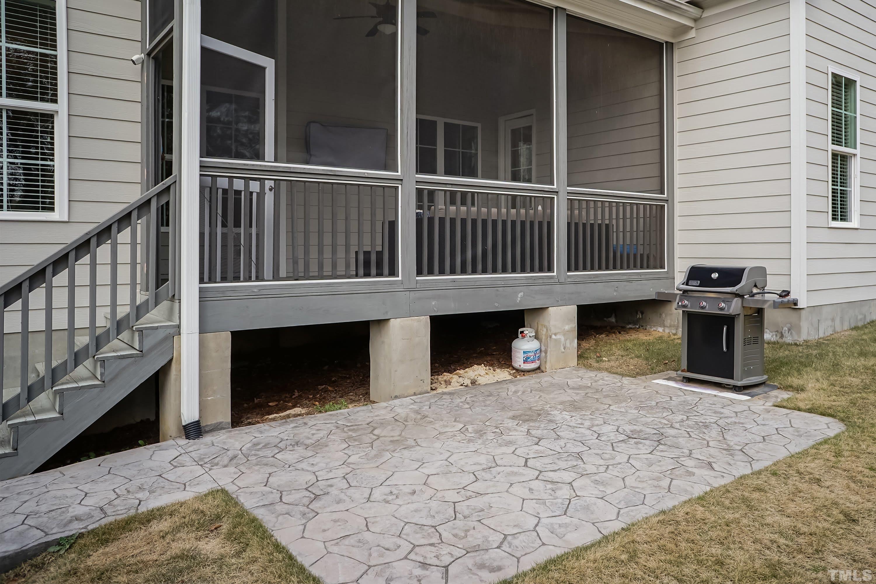 6418 Rosny Road Raleigh, NC 27613 - Photo 47 of 52 a view of a house with a balcony and front door